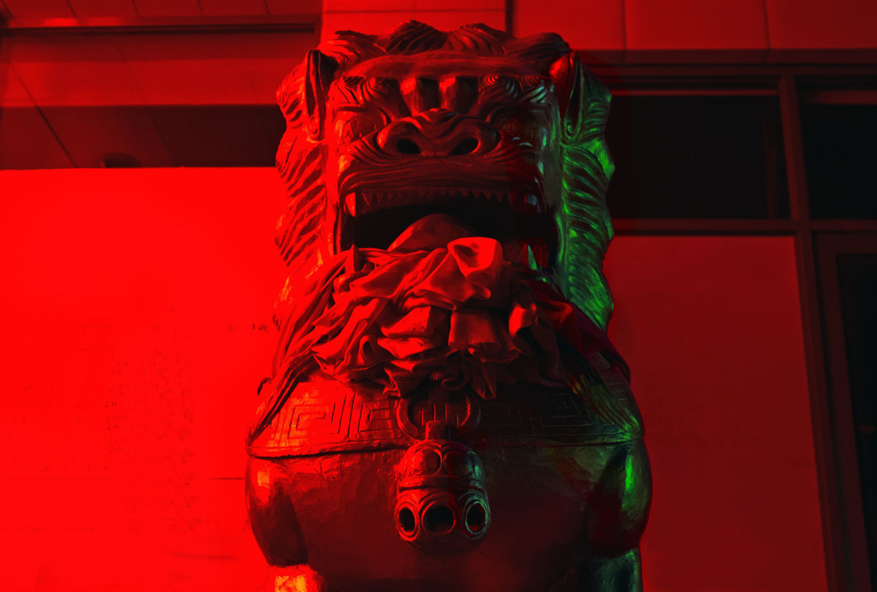 CLOSE-UP OF RED STATUE