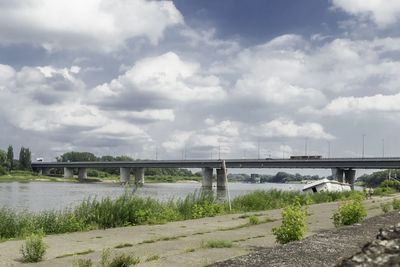Bridge over river against sky