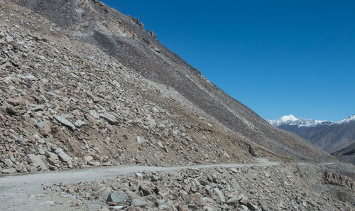 Scenic view of mountains against clear blue sky