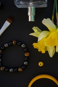 Close-up of yellow flower vase on table