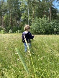 Full length of girl standing on field