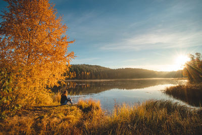 Scenic view of lake against sky during autumn