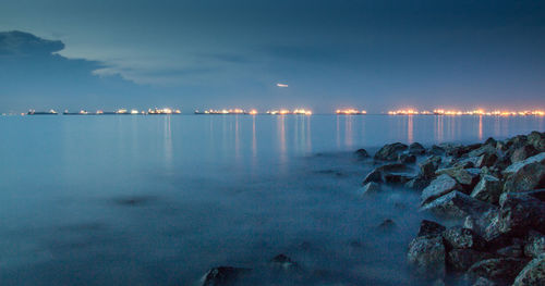 Scenic view of sea against sky at night