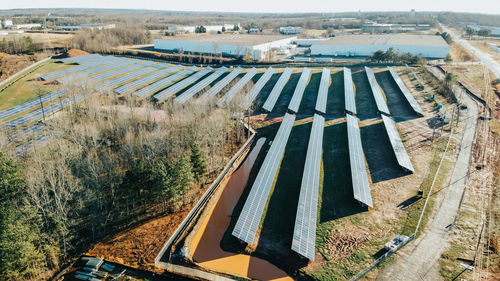 High angle view of road amidst trees in city