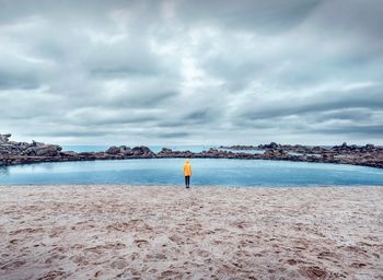 Scenic view of sea against cloudy sky
