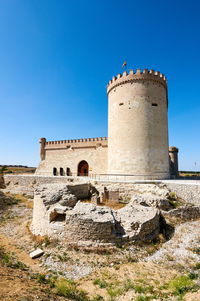 View of fort against blue sky