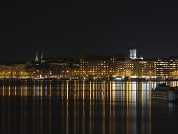 Illuminated buildings in city at night