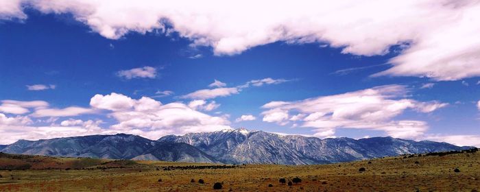 Landscape and mountain against sky