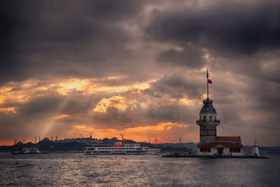 Scenic view of sea and buildings against sky during sunset. maiden's tower in turkey.