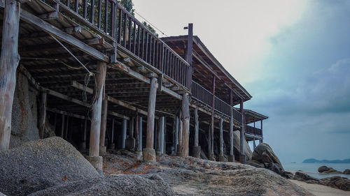 Low angle view of abandoned building against sky