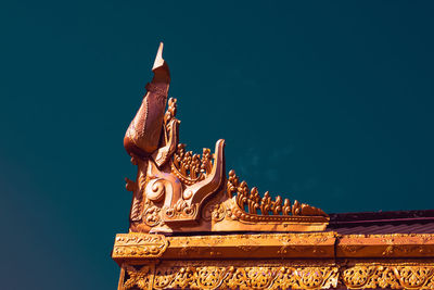 Low angle view of statue of temple against building
