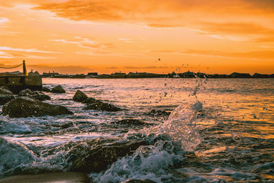 Scenic view of sea against sky during sunset