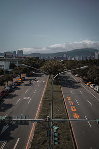 High angle view of vehicles on road against sky