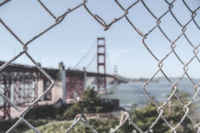 Chainlink fence seen through chainlink fence
