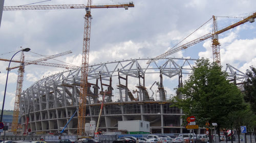 Low angle view of construction site against sky