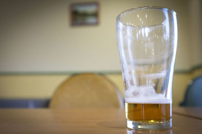 Close-up of beer in glass on table