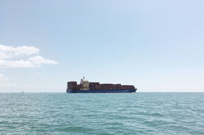 Ship on sea against sky