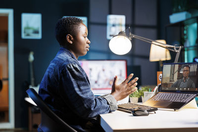 Young man using laptop at home