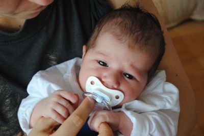 Close-up of mother and baby at home