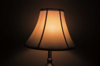 Close-up of lamp over black background