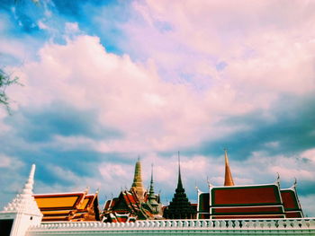 Low angle view of temple building against cloudy sky