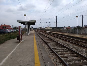 Railroad station platform against sky