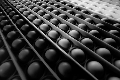 The background image is black and white with circular patterns arranged diagonally. 