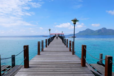 Pier over sea against sky