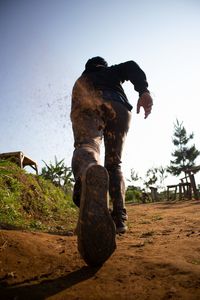 Man on field against clear sky