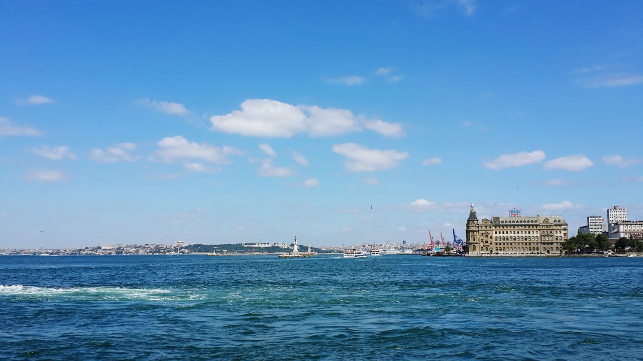 water, waterfront, architecture, built structure, building exterior, sea, sky, blue, cloud - sky, rippled, city, cloud, nautical vessel, transportation, river, nature, day, outdoors, scenics, no people