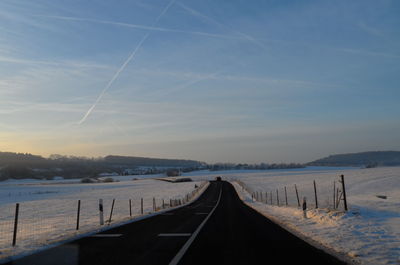 Road against sky during winter