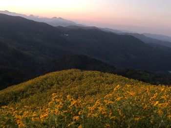 Scenic view of mountains against sky during sunset