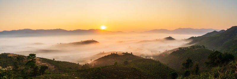 Scenic view of mountains against sky during sunset