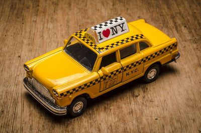 Close-up of yellow toy car on table