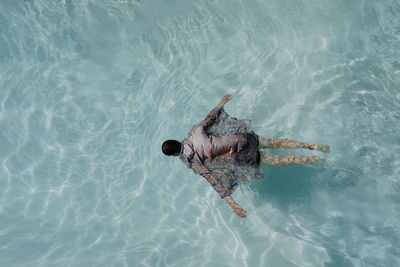 Directly above shot of man swimming in sea