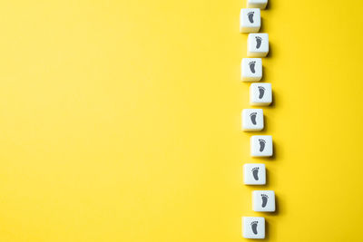 High angle view of text on yellow background