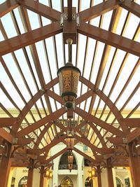 Low angle view of pendant lights hanging from ceiling