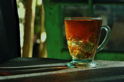 Close-up of tea in glass on table