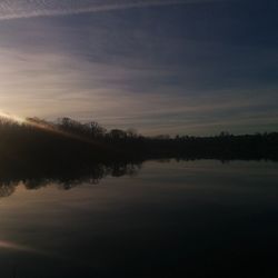 Reflection of clouds in calm lake