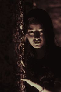 Portrait of beautiful young woman standing outdoors