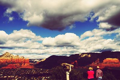 Scenic view of landscape against cloudy sky
