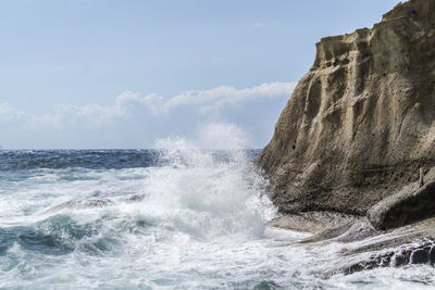 Waves splashing on rocks