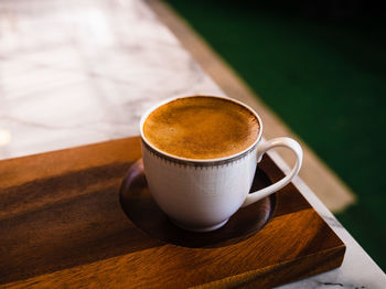 Close-up of coffee cup on table