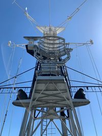 Low angle view of tower against clear blue sky