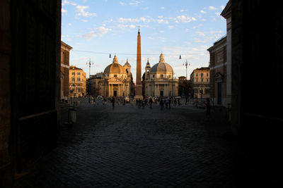 Entrance from piazzale flaminio to piazza del popolo in rome. overall view of the square at sunset.