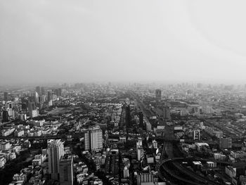 High angle view of city buildings against sky