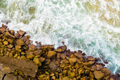 Scenic view of sea waves splashing on rocks