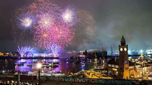 Firework display at night