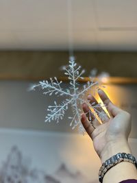 Close-up of hand holding umbrella