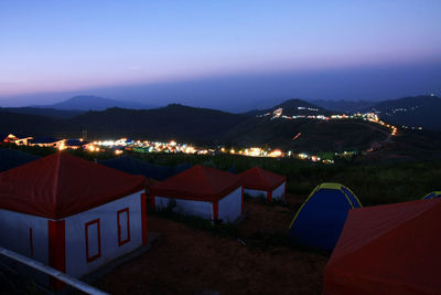 High angle view of illuminated tent against sky at night